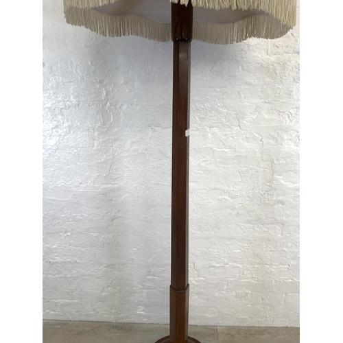 40 - A late Victorian mahogany standard lamp with white tasseled shade - approx. 152cm high (excluding sh... 