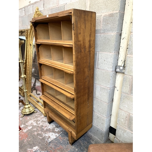 41 - A mid 20th century Staverton oak five door solicitor's cabinet - approx. 186cm high x 92cm wide x 36... 