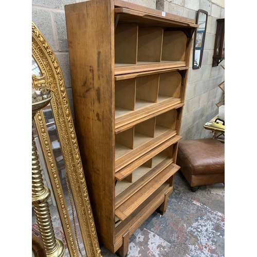 41 - A mid 20th century Staverton oak five door solicitor's cabinet - approx. 186cm high x 92cm wide x 36... 