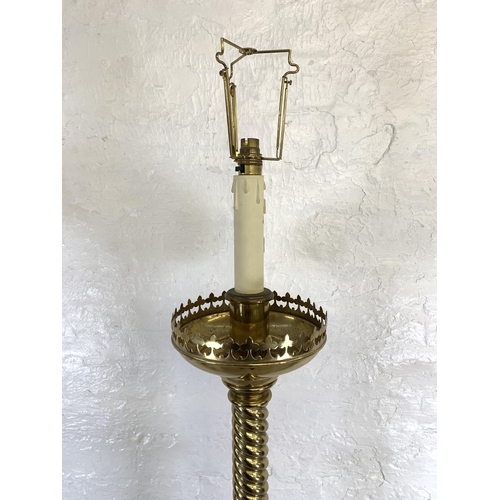 45 - A 19th century Gothic Revival ecclesiastical converted electric standard lamp on lion paw feet, step... 