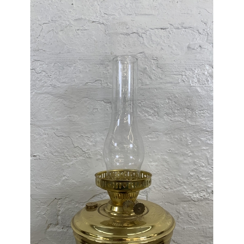 48 - A Victorian style brass converted electric oil lamp - approx. 51cm high