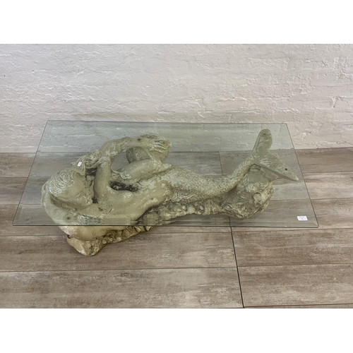 5 - A sculptural fibreglass mermaid and bevelled glass rectangular coffee table - approx. 41cm high x 12... 