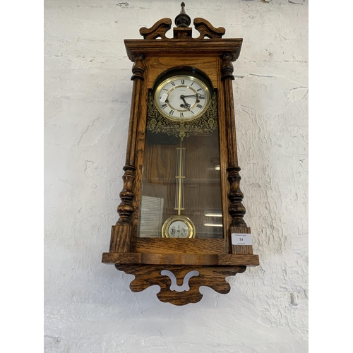 53 - A vintage Emperor Westminster chime oak wall clock - approx. 77cm high