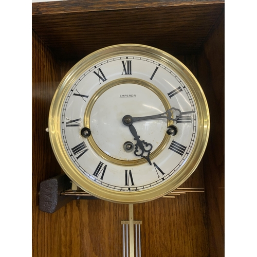 53 - A vintage Emperor Westminster chime oak wall clock - approx. 77cm high