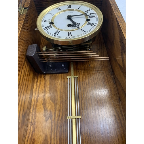 53 - A vintage Emperor Westminster chime oak wall clock - approx. 77cm high