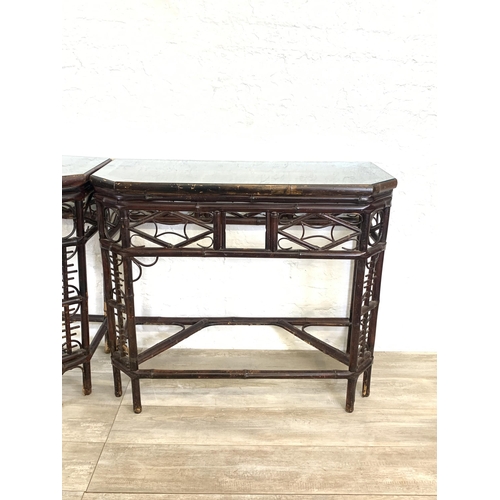 54 - A pair of vintage bamboo and glass topped console tables - approx. 81cm high x 96cm wide x 42cm deep