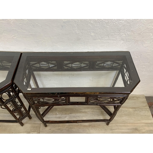 54 - A pair of vintage bamboo and glass topped console tables - approx. 81cm high x 96cm wide x 42cm deep