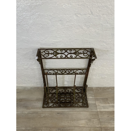 56 - A Victorian style cast iron boot rack with scraper - approx. 75cm high x 63cm wide x 33cm deep