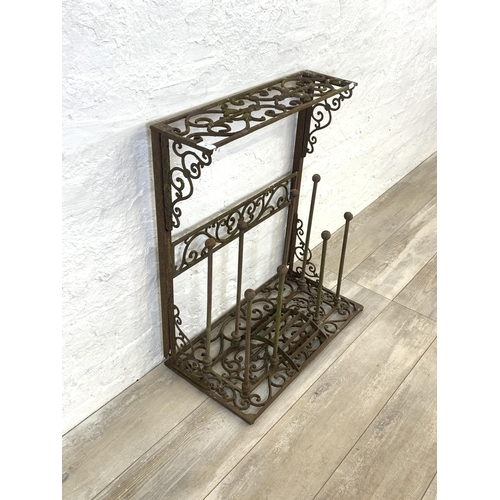 56 - A Victorian style cast iron boot rack with scraper - approx. 75cm high x 63cm wide x 33cm deep