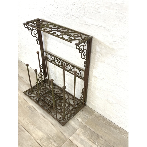 56 - A Victorian style cast iron boot rack with scraper - approx. 75cm high x 63cm wide x 33cm deep