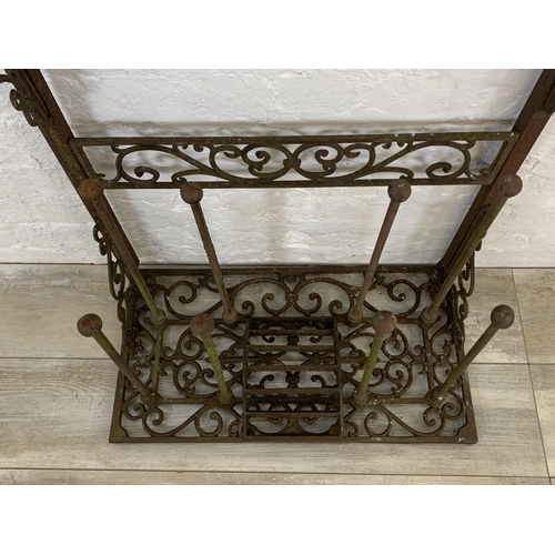 56 - A Victorian style cast iron boot rack with scraper - approx. 75cm high x 63cm wide x 33cm deep