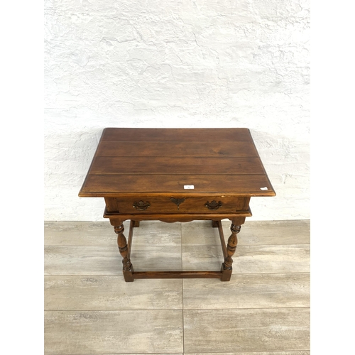 58 - A Theodore Alexander mahogany side table - approx. 72cm high x 74cm wide x 47.5cm deep