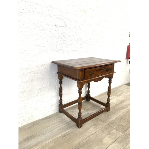 58 - A Theodore Alexander mahogany side table - approx. 72cm high x 74cm wide x 47.5cm deep