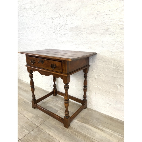 58 - A Theodore Alexander mahogany side table - approx. 72cm high x 74cm wide x 47.5cm deep