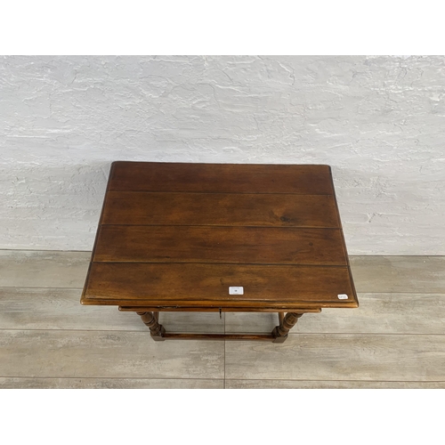 58 - A Theodore Alexander mahogany side table - approx. 72cm high x 74cm wide x 47.5cm deep