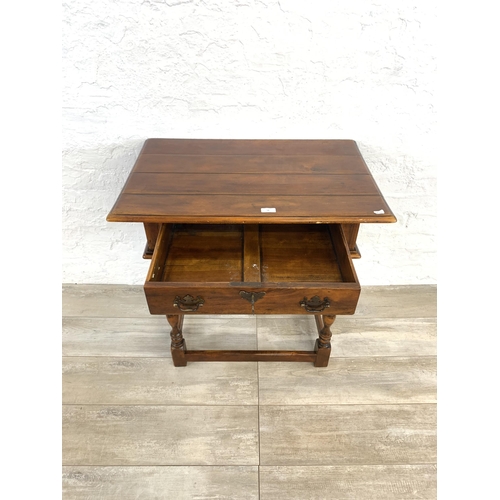 58 - A Theodore Alexander mahogany side table - approx. 72cm high x 74cm wide x 47.5cm deep