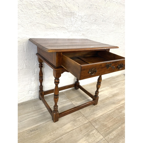 58 - A Theodore Alexander mahogany side table - approx. 72cm high x 74cm wide x 47.5cm deep