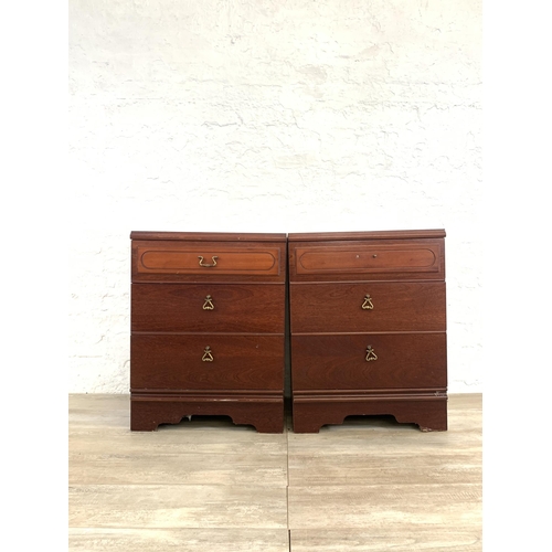 60 - A pair of 1980s mahogany bedside chests of three drawers - approx. 67cm high x 51cm wide x 42cm deep