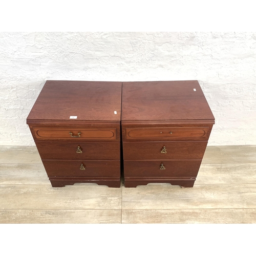 60 - A pair of 1980s mahogany bedside chests of three drawers - approx. 67cm high x 51cm wide x 42cm deep