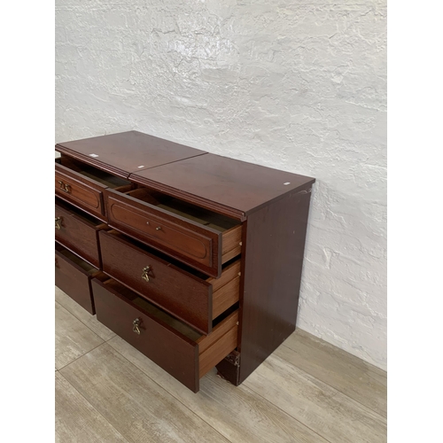 60 - A pair of 1980s mahogany bedside chests of three drawers - approx. 67cm high x 51cm wide x 42cm deep