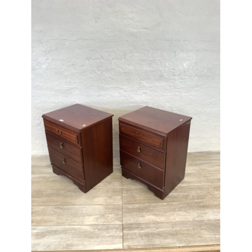 60 - A pair of 1980s mahogany bedside chests of three drawers - approx. 67cm high x 51cm wide x 42cm deep