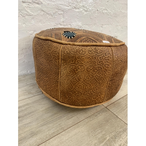 61 - A vintage Moroccan brown leather circular footstool