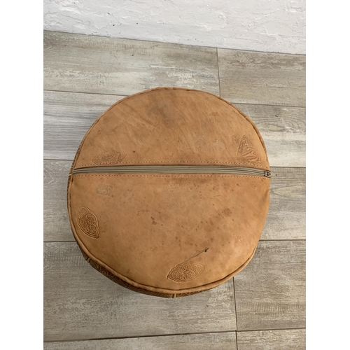 61 - A vintage Moroccan brown leather circular footstool