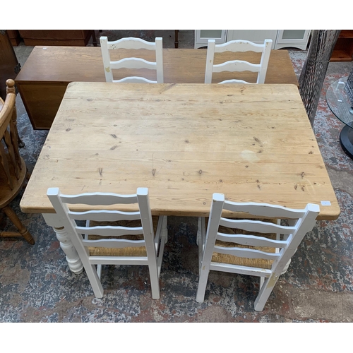 65 - A Victorian style white painted pine farmhouse dining table with four ladderback rush seated dining ... 