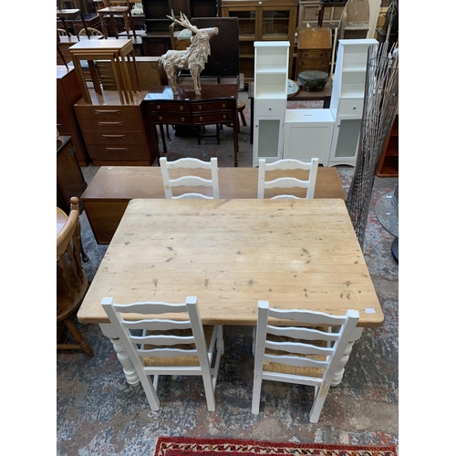 65 - A Victorian style white painted pine farmhouse dining table with four ladderback rush seated dining ... 