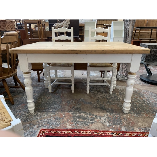 65 - A Victorian style white painted pine farmhouse dining table with four ladderback rush seated dining ... 