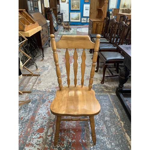 67 - A oak extending dining table with four oak farmhouse dining chairs