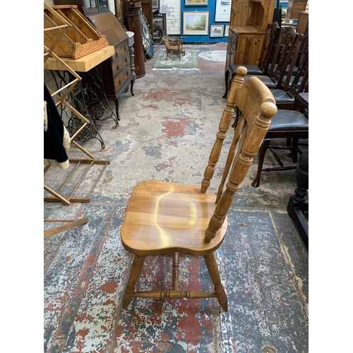 67 - A oak extending dining table with four oak farmhouse dining chairs