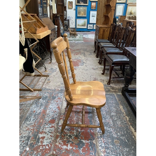 67 - A oak extending dining table with four oak farmhouse dining chairs