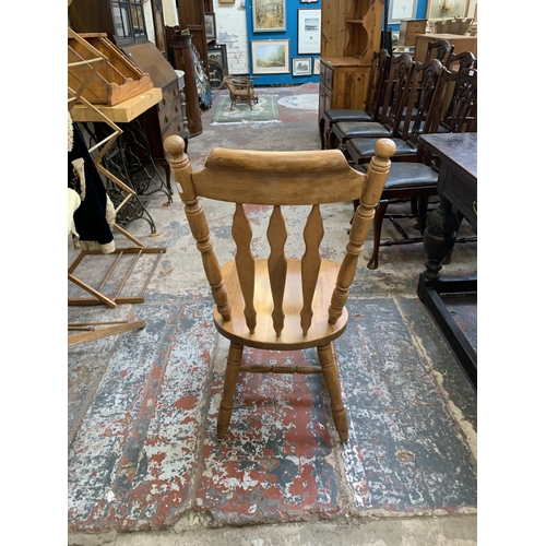 67 - A oak extending dining table with four oak farmhouse dining chairs