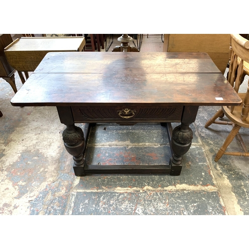 68 - A Jacobean Revival oak refectory table - approx. 73cm high x 128cm long x 70cm wide