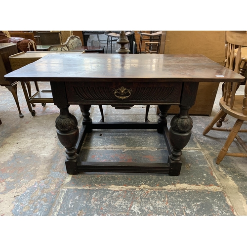 68 - A Jacobean Revival oak refectory table - approx. 73cm high x 128cm long x 70cm wide