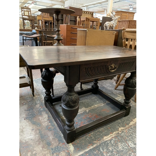 68 - A Jacobean Revival oak refectory table - approx. 73cm high x 128cm long x 70cm wide