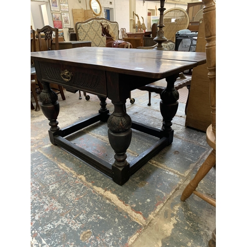 68 - A Jacobean Revival oak refectory table - approx. 73cm high x 128cm long x 70cm wide