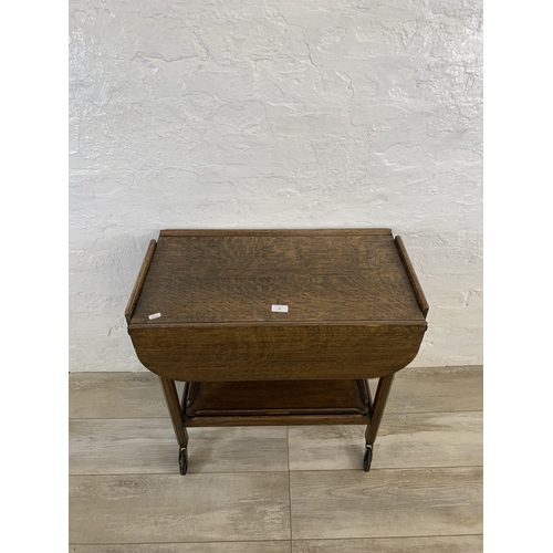 74 - A mid 20th century oak drop leaf tea trolley