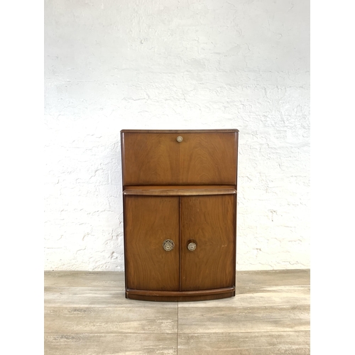 76 - A mid 20th century walnut cocktail  cabinet - approx. 93cm high x 61cm wide x 32cm deep