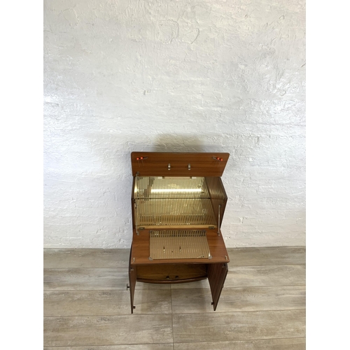 76 - A mid 20th century walnut cocktail  cabinet - approx. 93cm high x 61cm wide x 32cm deep