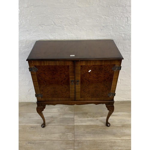 77 - A late 20th century Queen Anne style burr walnut cocktail cabinet on cabriole supports - approx. 97c... 