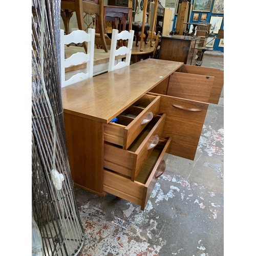 79 - A mid 20th century Avalon teak sideboard - approx. 72cm high x 183cm long x 43cm deep