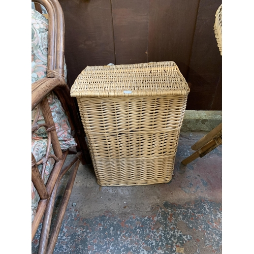 8 - Ten pieces of wicker furniture and baskets to include 1970s tub chair, picnic basket, twin handled b... 