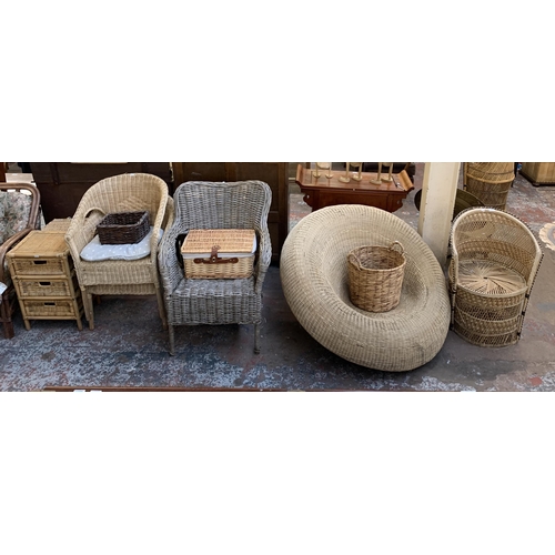 8 - Ten pieces of wicker furniture and baskets to include 1970s tub chair, picnic basket, twin handled b... 