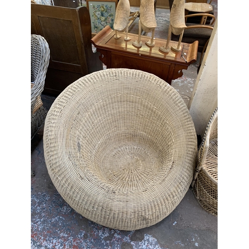 8 - Ten pieces of wicker furniture and baskets to include 1970s tub chair, picnic basket, twin handled b... 