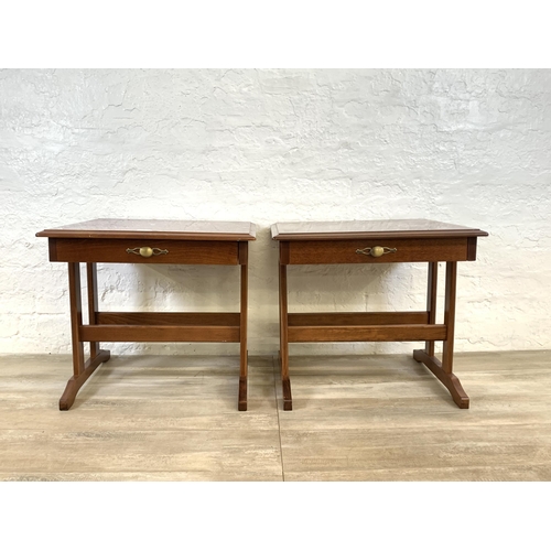 82 - A pair of stained mahogany bedside tables - approx. 52cm high x 57cm wide x 51cm deep