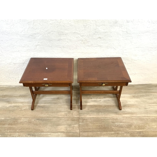 82 - A pair of stained mahogany bedside tables - approx. 52cm high x 57cm wide x 51cm deep