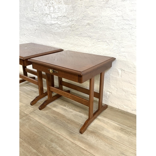 82 - A pair of stained mahogany bedside tables - approx. 52cm high x 57cm wide x 51cm deep