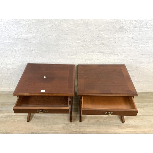 82 - A pair of stained mahogany bedside tables - approx. 52cm high x 57cm wide x 51cm deep